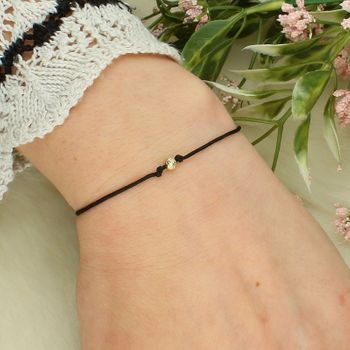 Bransoletka szczęścia złota 585 na czarnym sznurku z kuleczką – regulowana bransoletka damska brans.jpg