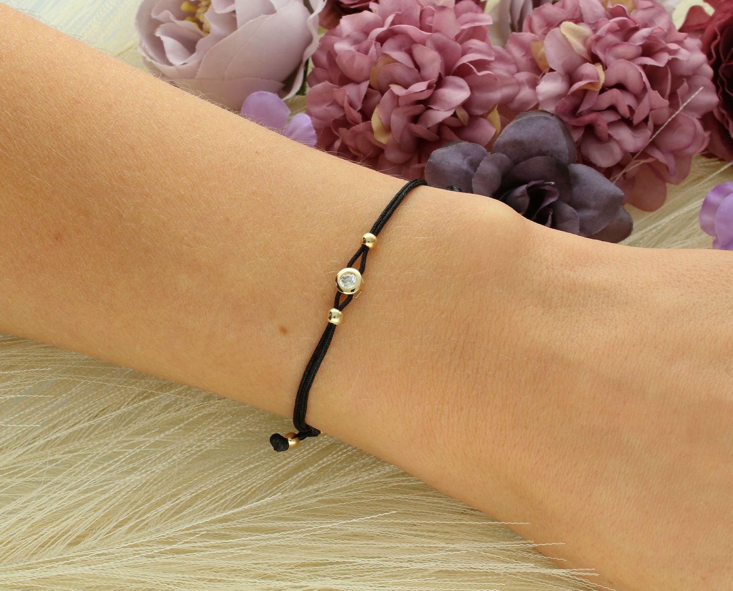 Złota bransoletka na czarnym sznurku z cyrkonią próba 585, DIA-BRA-12675-585.jpg