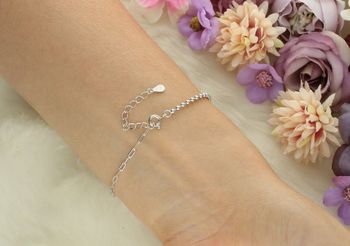 Srebrna bransoletka damska próby 925 z kokardką zdobioną cyrkoniami. Model DIA-BRA-13347-925 – kobieca elegancja, delikatność i styl. Idealna na prezent!3.jpg