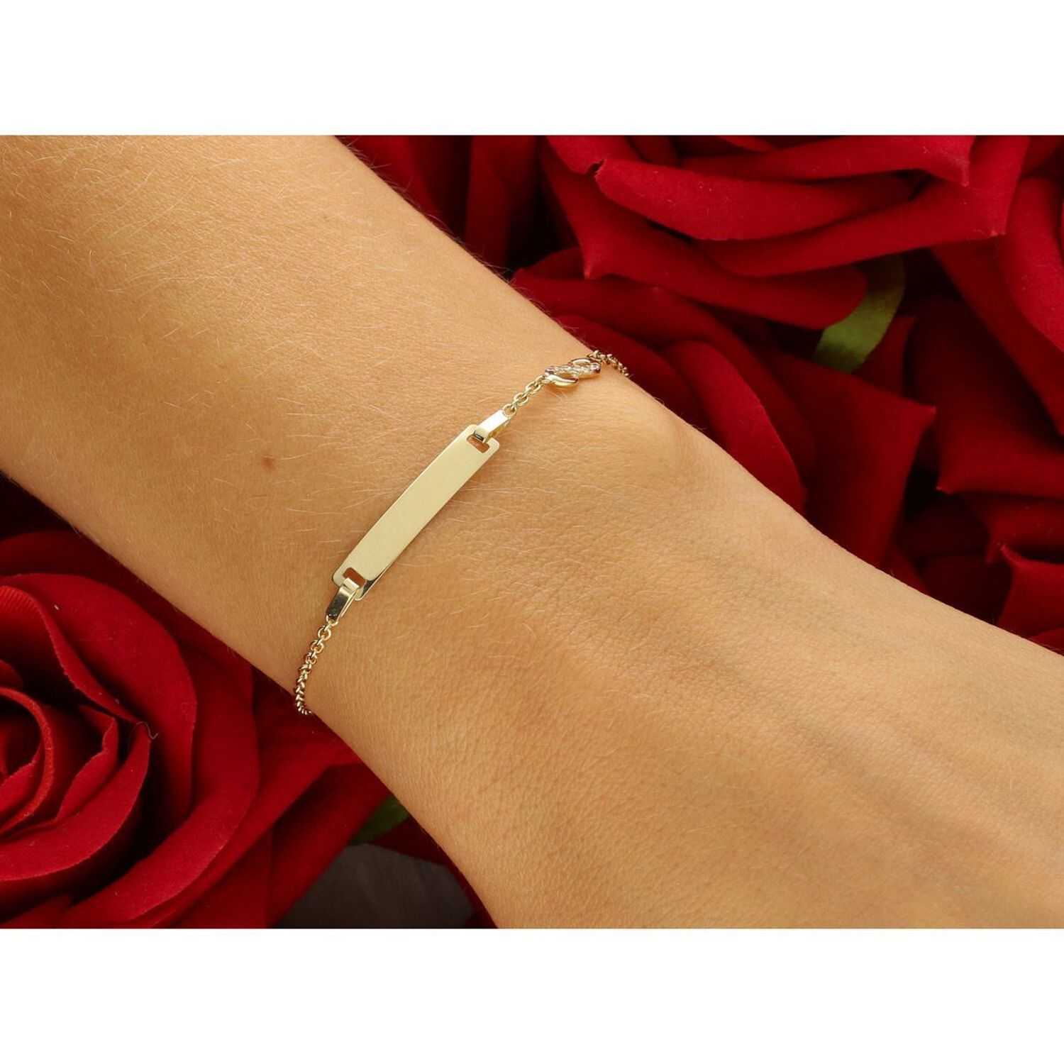 Delikatna złota bransoletka dziecięca próby 585, zdobiona prostokątną blaszką idealną na grawer oraz znakiem nieskończoności z cyrkoniami. Długość regulowana 12 cm + 3 cm, waga 1,76 g, 1.jpg