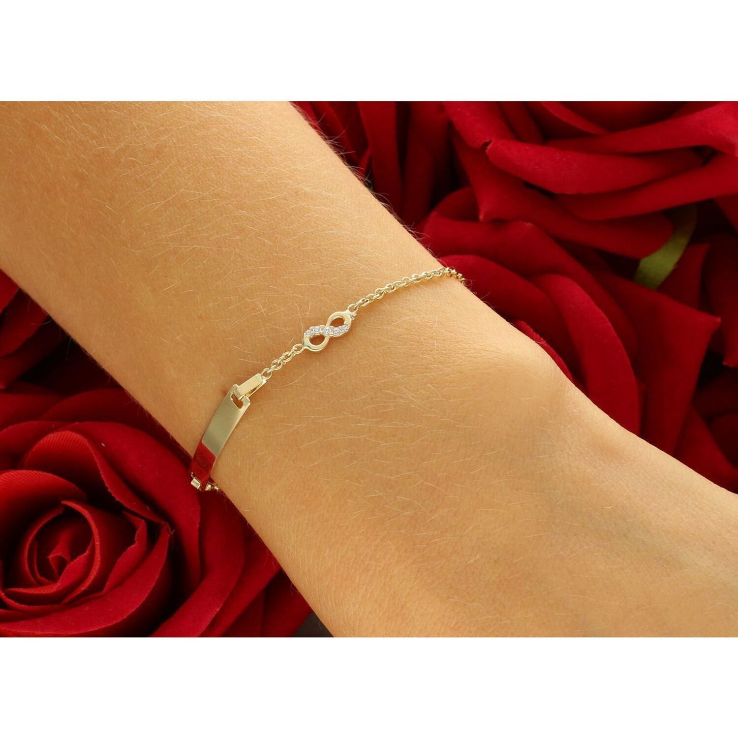 Delikatna złota bransoletka dziecięca próby 585, zdobiona prostokątną blaszką idealną na grawer oraz znakiem nieskończoności z cyrkoniami. Długość regulowana 12 cm + 3 cm, waga 1,76 g, 1.jpg