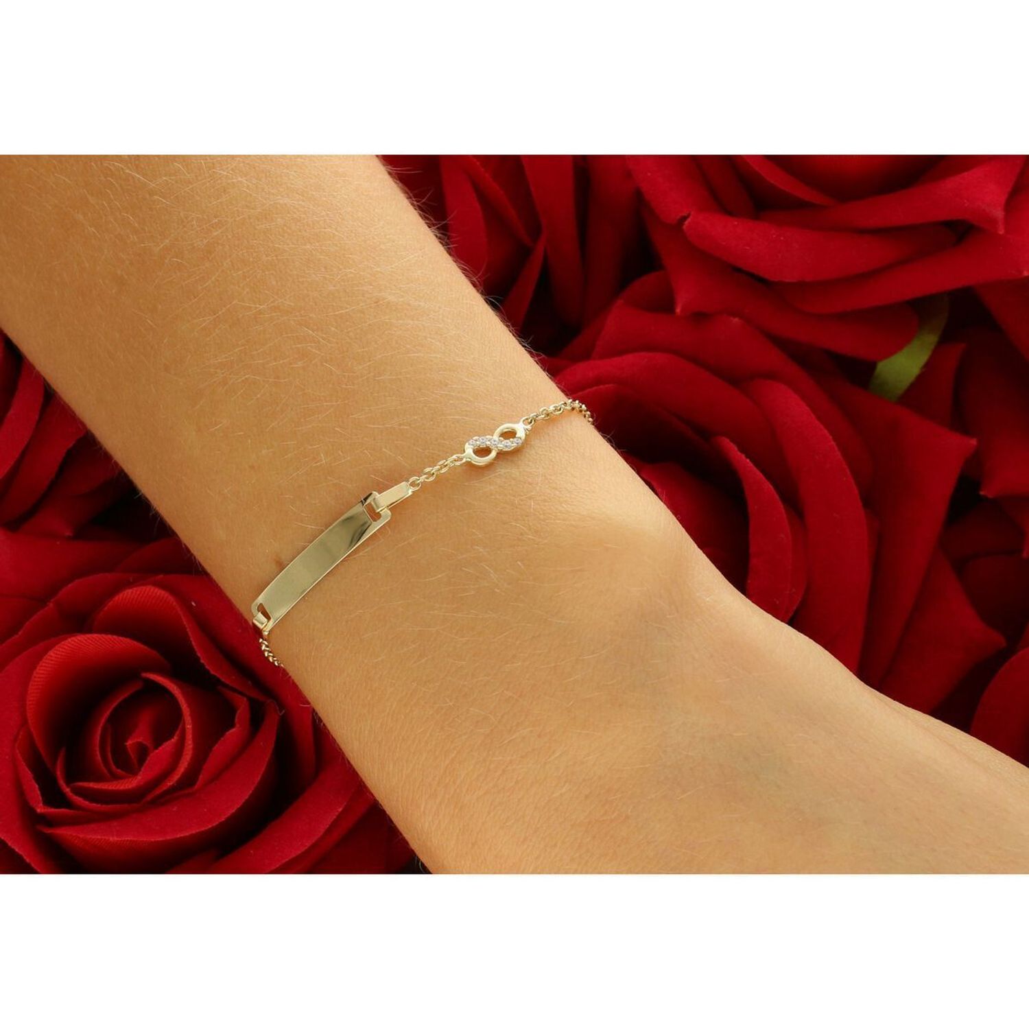 Delikatna złota bransoletka dziecięca próby 585, zdobiona prostokątną blaszką idealną na grawer oraz znakiem nieskończoności z cyrkoniami. Długość regulowana 12 cm + 3 cm, waga 1,76 g, 1.jpg