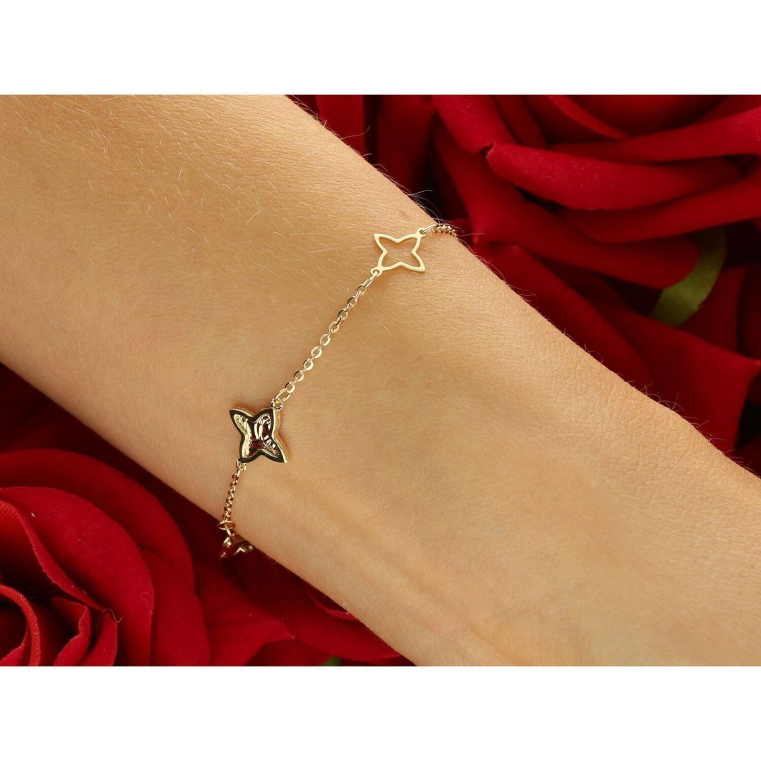 Elegancka złota bransoletka damska próby 585, zdobiona kwiatkami. Długość 18 cm, waga 1,96 g, zapięcie na karabińczyk. Stylowy dodatek idealny na prezent i codzienne noszenie.1.jpg