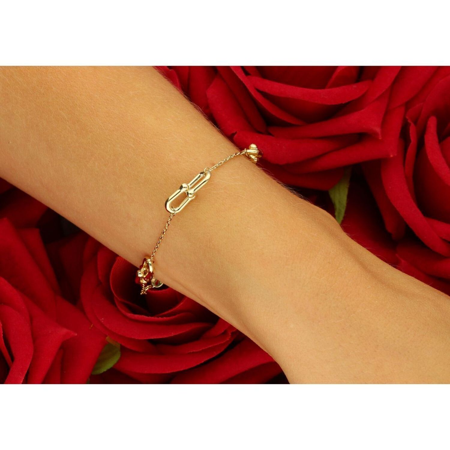 Elegancka złota bransoletka damska próby 585 w stylu ankier, zdobiona elementami ozdobnymi typu Cariterr. Długość 17 cm + 3 cm, waga 2,37 g, zapięcie na karabińczyk. Idealna do codziennych1.jpg