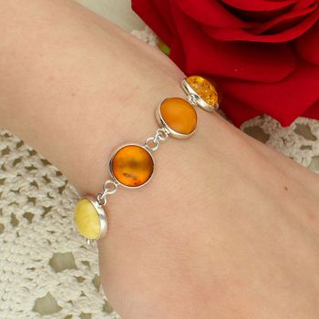 Bransoletka srebrna z bursztynami w żółto-miodowych odcieniach okrągłe.jpg