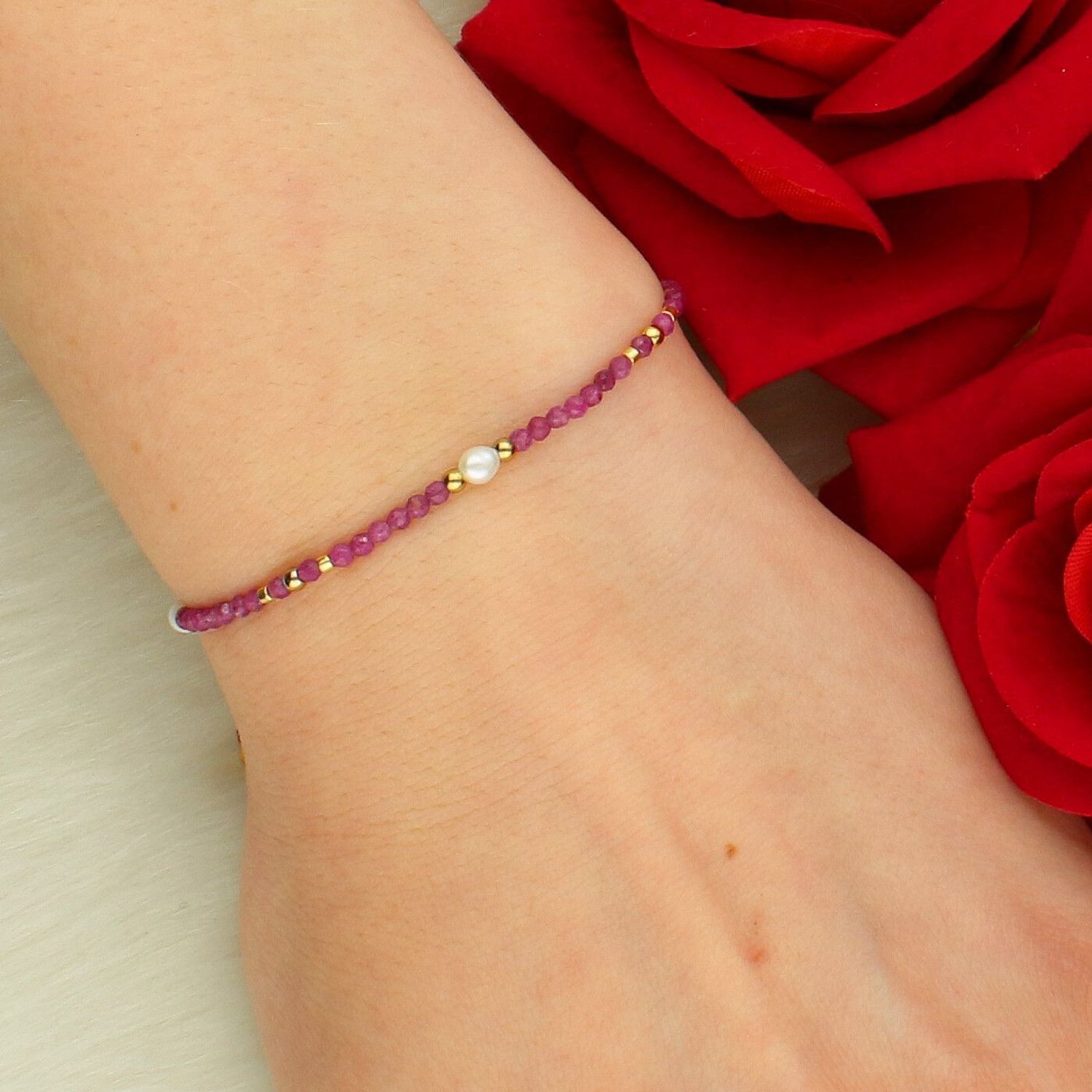 Bransoletka z kamieniami naturalnymi rubin i perła hodowlana na sznurku DIA-BRA-14196-STAL.jpg