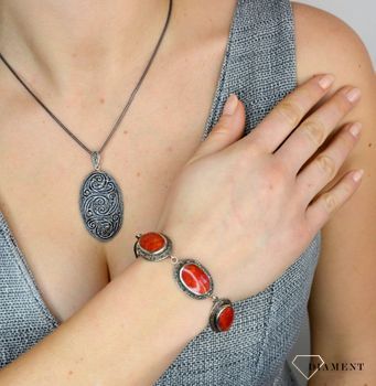 Bransoletka z markazytami i czerwonymi kamieniami DIA-BRA-2506-925  to piękna bransoletka wykonana w wysokiej próbie srebra 925. Bransoletka z markazytami to propozycja od sklepu jubilerskiego Diame.JPG