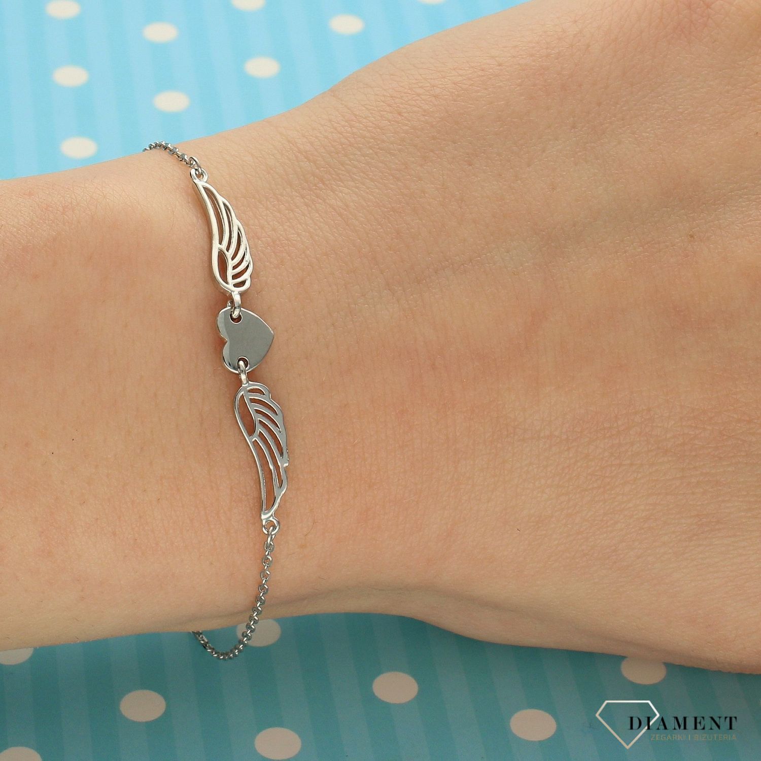 Srebrna bransoletka celebrytka serce ze skrzydłami DIA-BRA-3575-925 (1).jpg