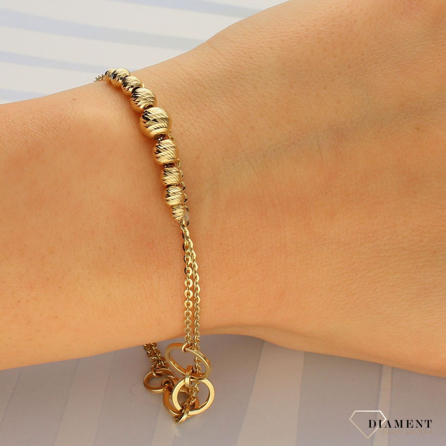 Złota bransoletka zdobiony podwójny łańcuszek DIA-BRA-4252-585. Złota bransoletka o nowoczesnym wyglądzie to idealny pomysł na prezent dla wyjątkowej kobiety (1).jpg