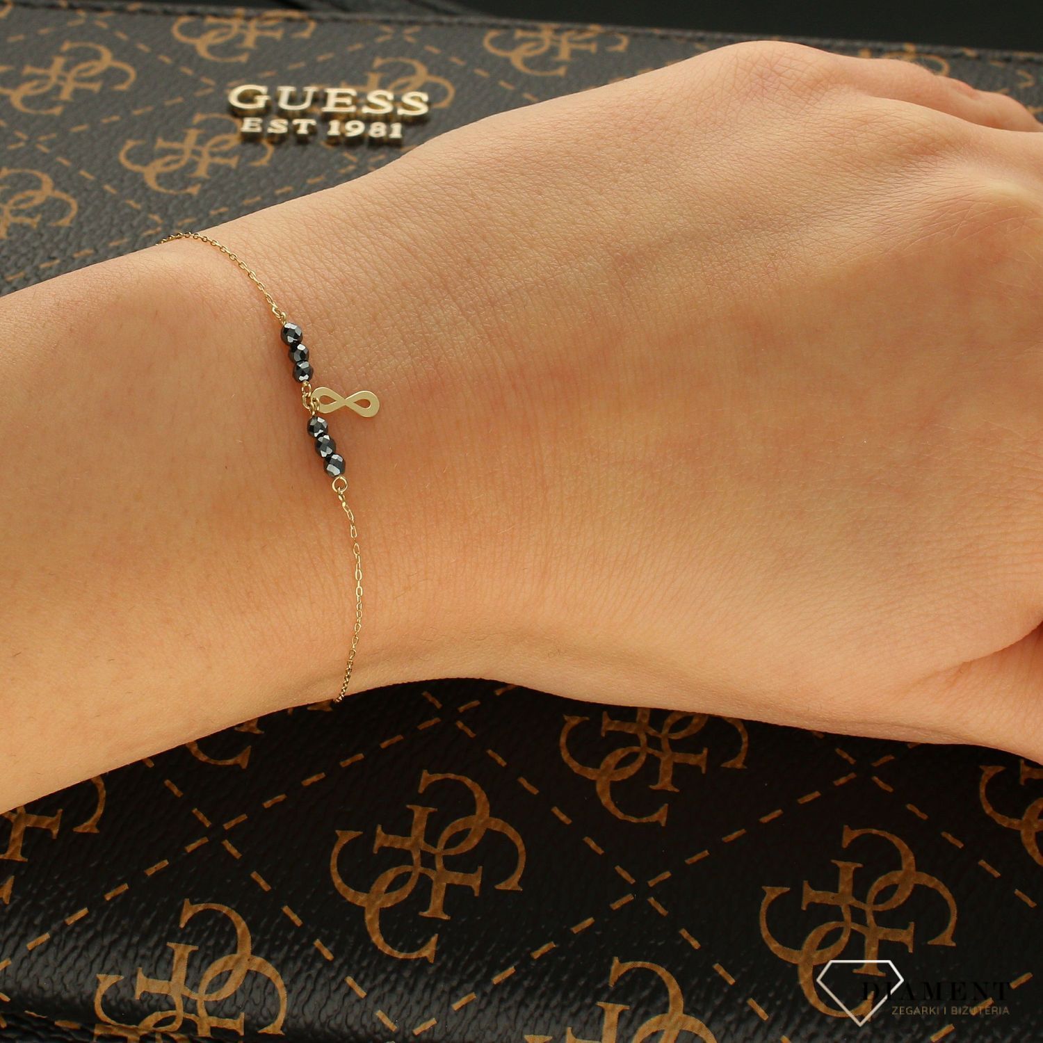 Złota bransoletka celebrytka znak nieskończoności z czarną cyrkonią DIA-BRA-4456-585.jpg