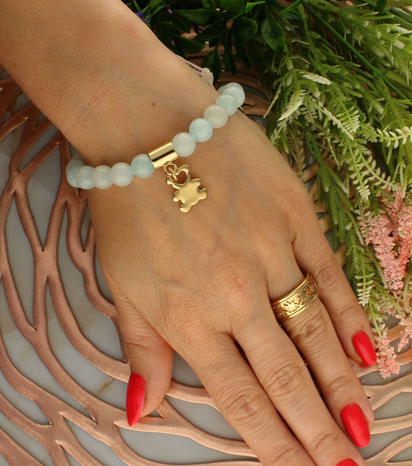 Bransoletka damska na gumce błękitne koraliki z pozłoconym misiem DIA-BRA-5688-INNE. Bransoletka damska na gumce. Bransoletka z koralików. Bransoletka damska z pozłoconym misiem. Bransoletka damska idealna na prezent.  (2).jpg