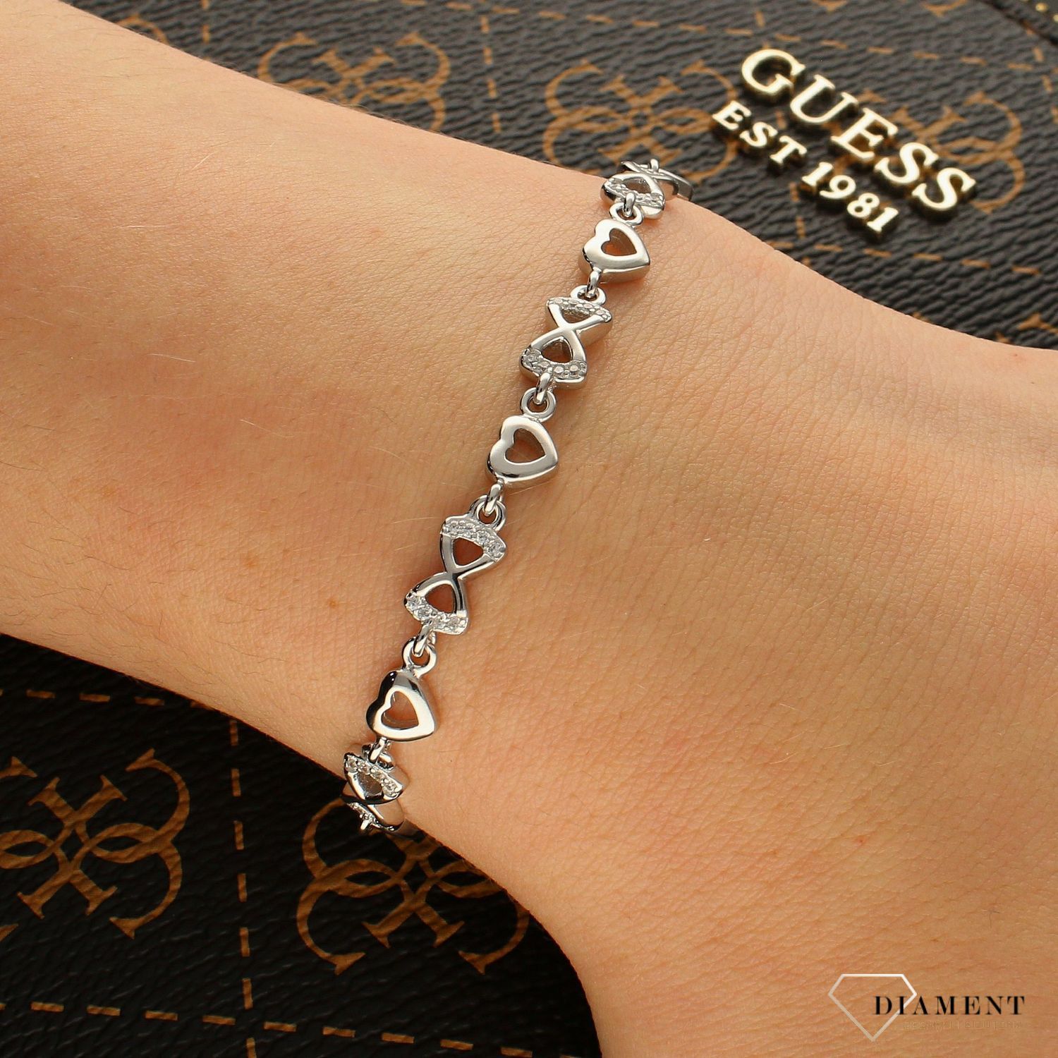 Srebrna bransoletka Serduszko z kokardką DIA-BRA-6275-925. Srebrna bransoletka kobieca. Bransoletka delikatna. Bransoletka srebrna z cyrkoniami.  Bransoletka serce i kokardka. Bransoletka srebrna idealna na (1).jpg