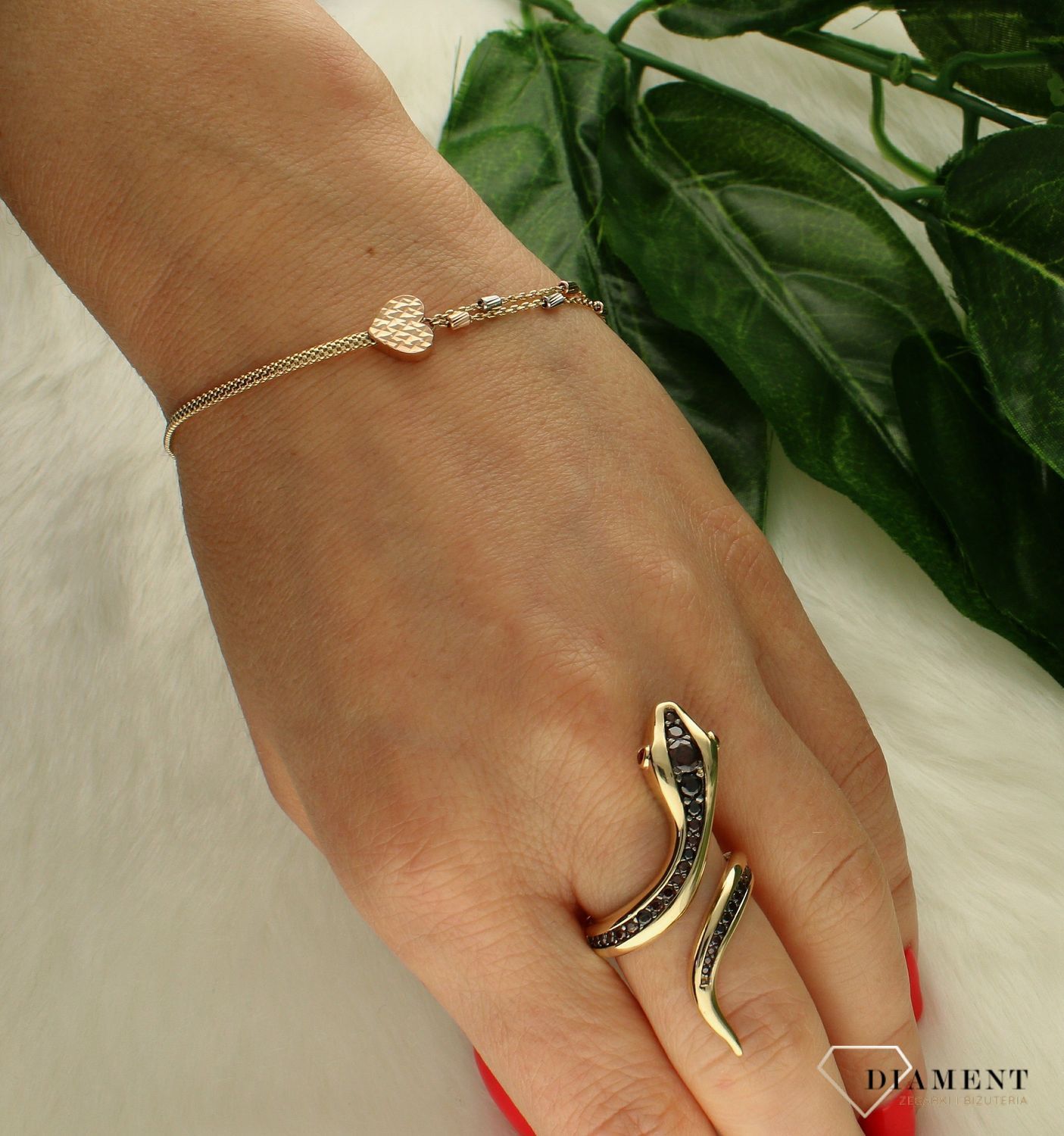 Złota bransoletka damska 585 z ozdobnymi elementami DIA-BRA-8578-585. Złota bransoletka damska 585 z ozdobnymi elementami. Bransoletka celebrytka wykonana z najwyższej jakości złota próby 585. Niezwykły blask szlachetnego kruszcu (1).jpg