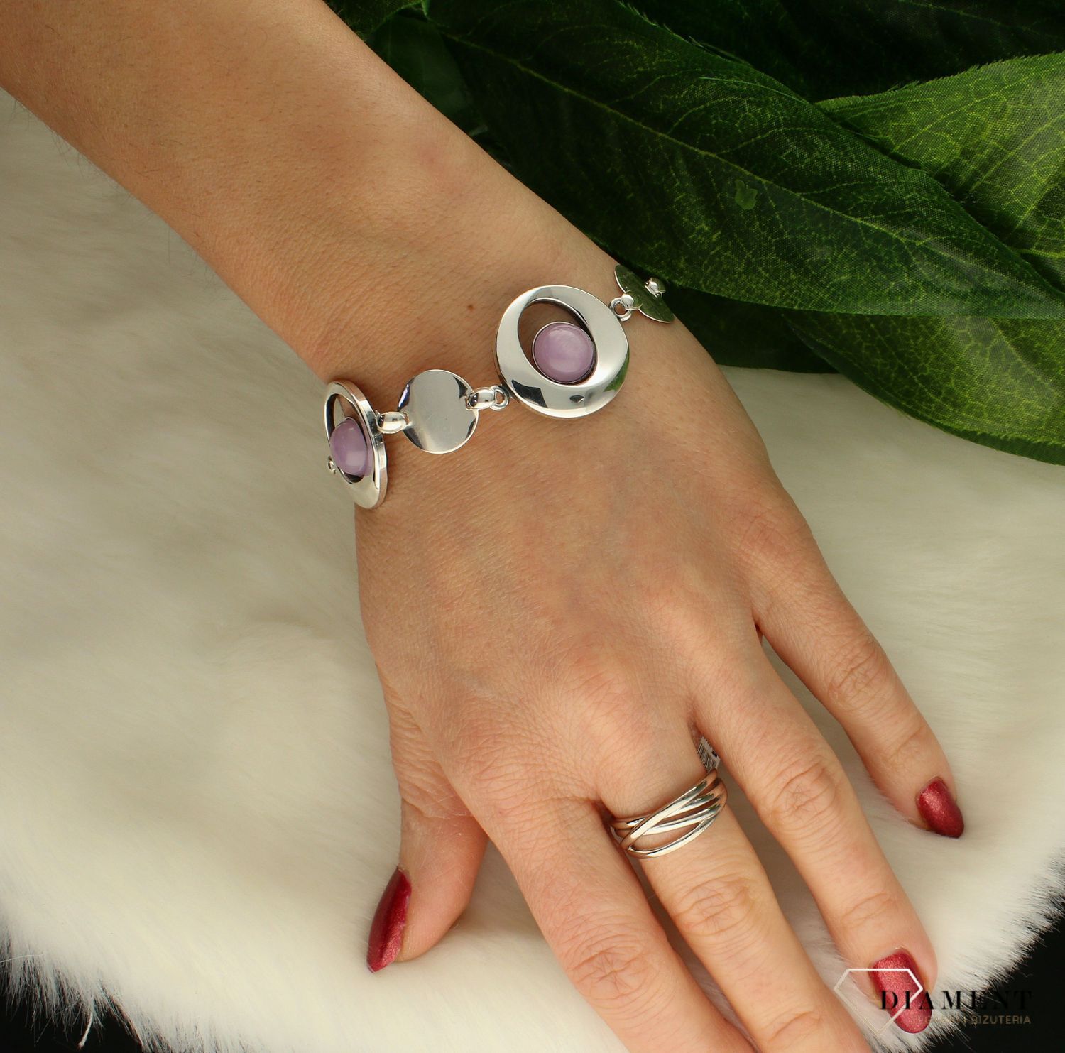 Bransoletka srebrna z fioletowym 'Kocim okiem' DIA-BRA-8858-925. Bransoletka z kamieniem syntetycznym przypominającym Kocie oko. Kamień jest w wyjątkowym jasnofioletowym kolorze. Bransoletka z kamieniami idealna na prezent. .jpg