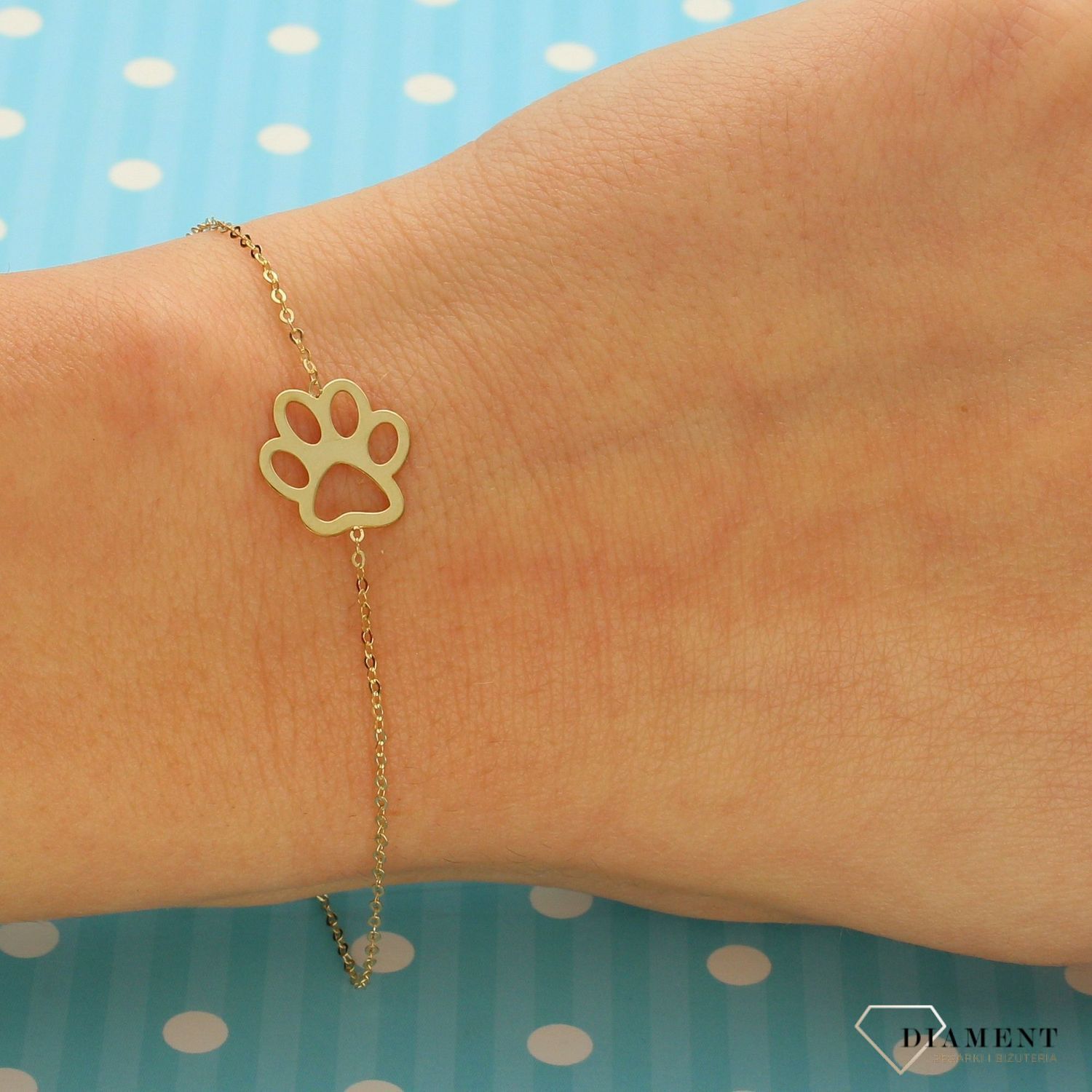 Złota bransoletka 585 celebrytka 'łapka' DIA-BRA-AS340BG8K-333 od Sklepu Jubilerskiego Diament to propozycja dla kobiet, które uwielbiają lśnić oraz cenią subtelną, beztroską elegancję. Idealna na prezent..jpg