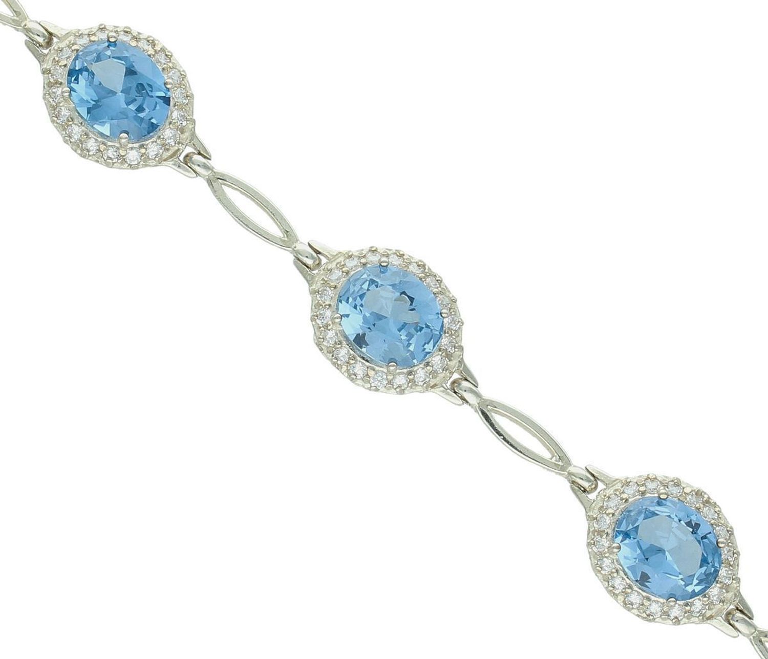 Olśniewająca srebrna bransoletka z dużymi niebieskimi i białymi cyrkoniami. Waga 17,30 g, długość 20 cm, zapinana na karabińczyk. Stylowy dodatek dla kobiet.1.jpg