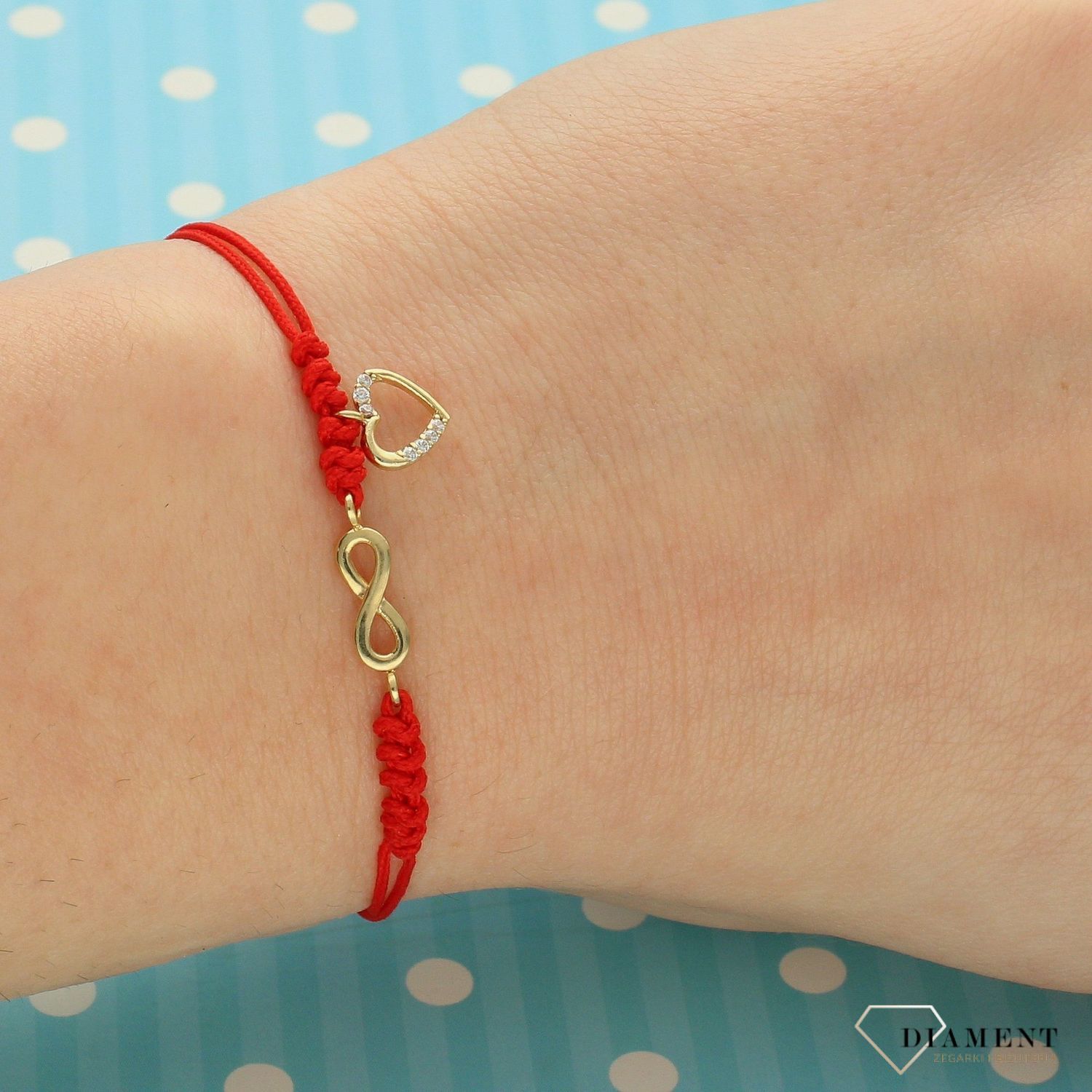 Złota bransoletka na czerwonym sznurku nieskończoność i serce z cyrkonią DIA-BRA-LU025G8K-333 (1).jpg