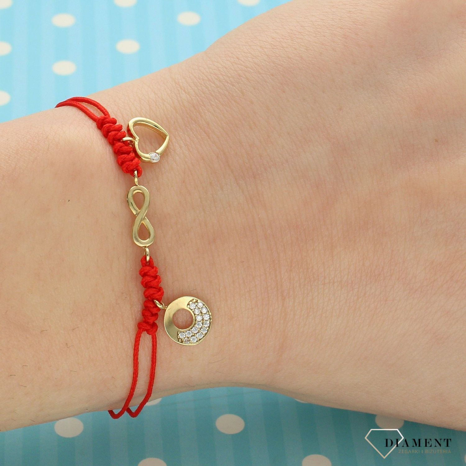 Złota bransoletka na czerwonym sznurku nieskończoność, kółko i serce DIA-BRA-LU042BG8K-333.jpg