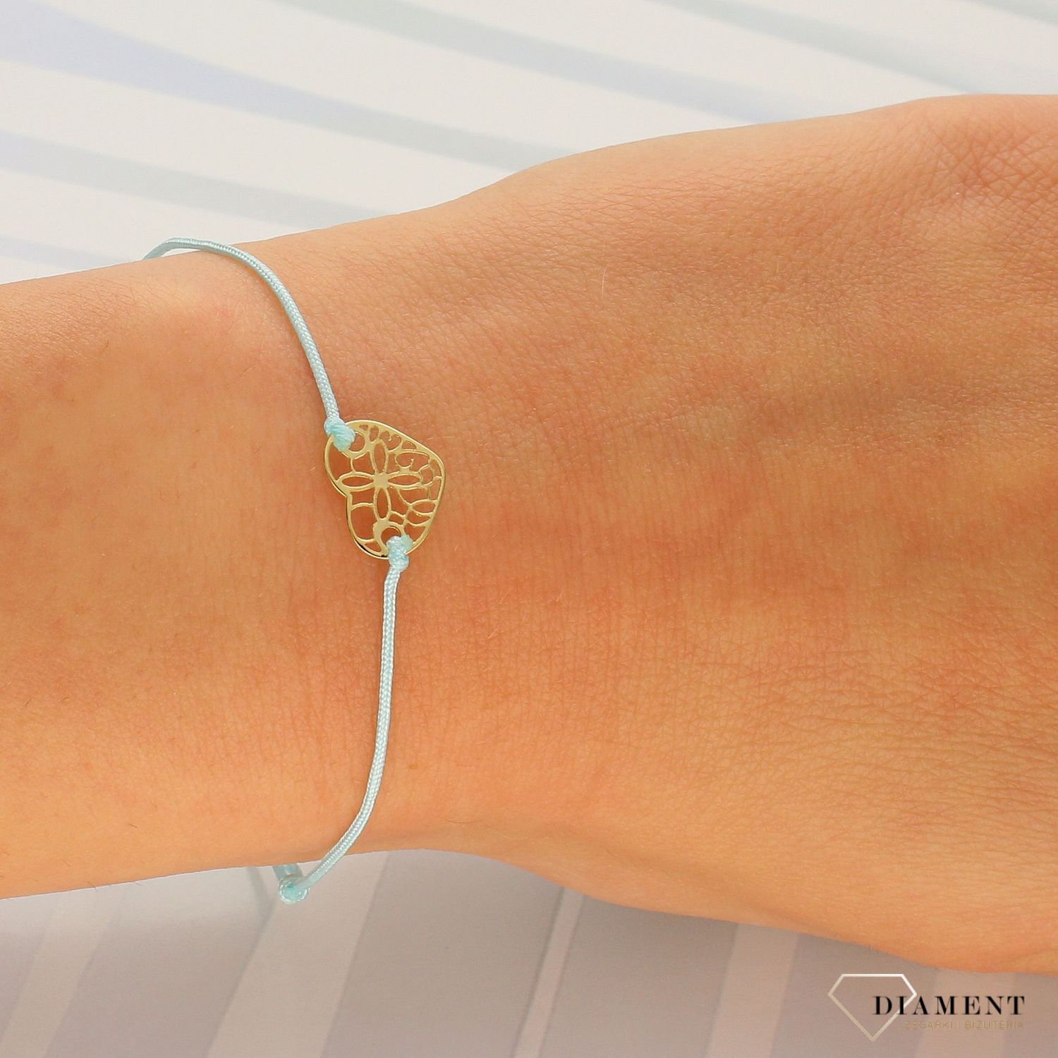 Bransoletka na błękitnym sznurku z ażurowym sercem DIA-BRA-LU056G8KMINT (1).jpg