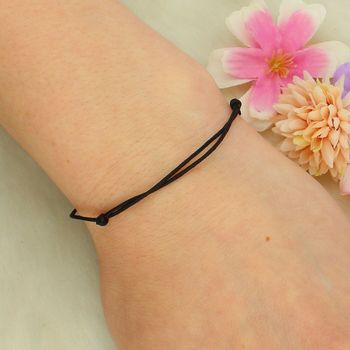 Bransoletka czarny sznurek z motywem pozłacanego kwiata lotosu tył.jpg