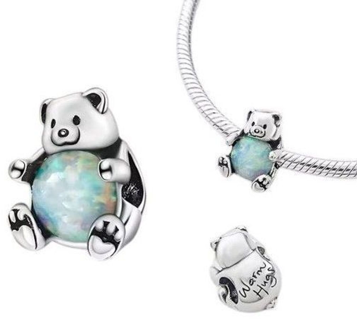 Zawieszka charms Miś ze srebra rodowanego Ag 925 z opalizującym brzuszkiem i grawerem „Warm Hugs”. Uroczy, symboliczny prezent pełen czułości.1.jpg