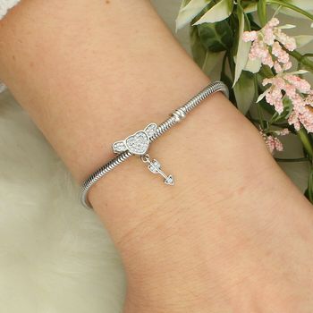 Srebrny charms z sercem, skrzydłami i strzałą z cyrkoniamiv Ag.jpg