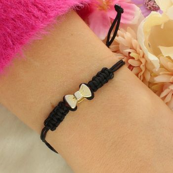 Delikatna bransoletka srebrna 925 pozłacana z kokardką na czarnym sznurku. Regulowane zapięcie ściągane, lekka i elegancka, waga 2 g.2.jpg