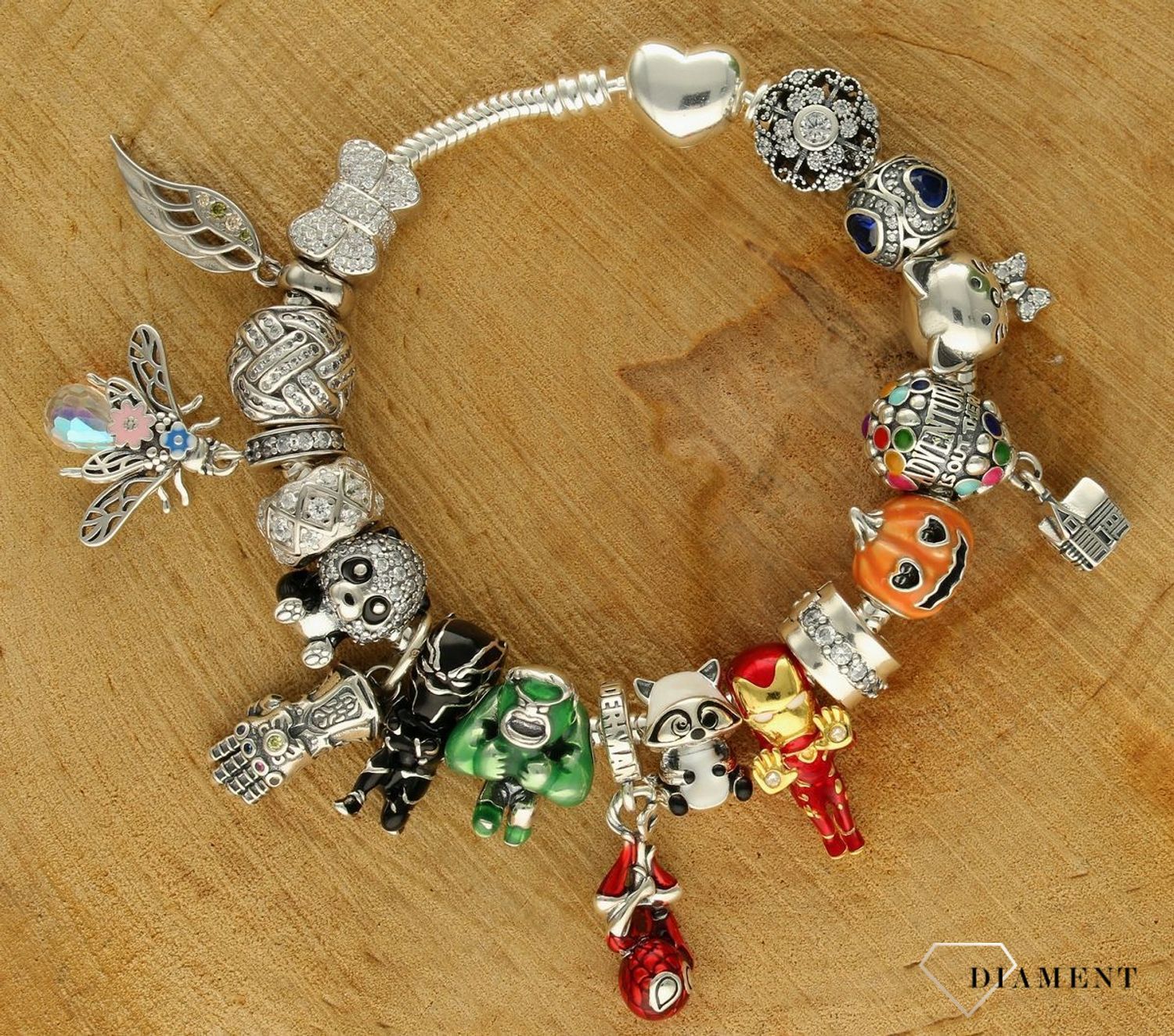 Charms Moments okrągły niebieskie serduszka DIA-CHA-9514G-925. Modny charms do bransoletki okrągły z cyrkoniami. Zawieszka wykonana została ze srebra próby 925. Charms do bransoletki typu Pandora. Idealny charms na prezent (1).jpg