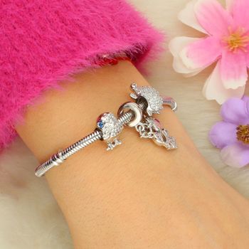 Delikatny charms srebrny AG 925 w kształcie ptaka z niebieską cyrkonią. Elegancka i lekka zawieszka do bransoletki lub naszyjnika, ok. 11,5 mm długości.7.jpg