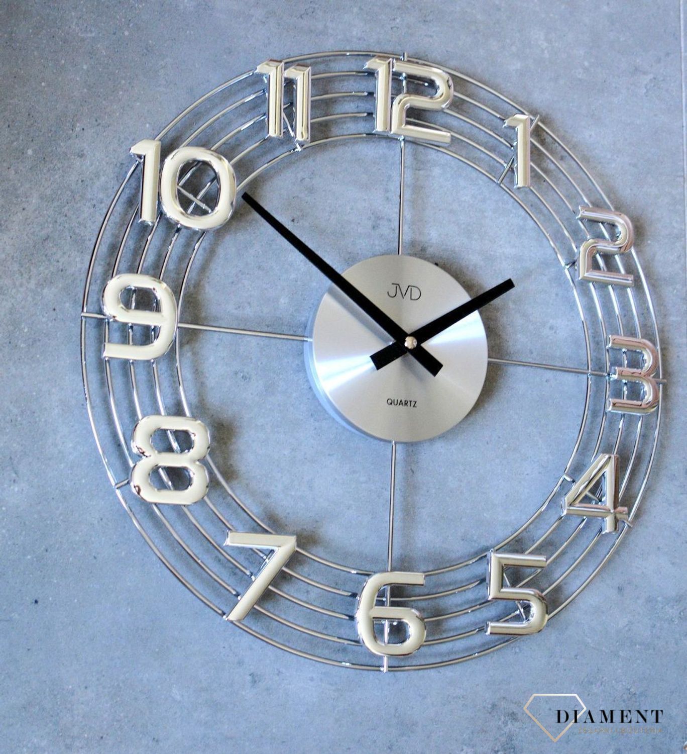 Zegar ścienny 3D JVD HT112.1 wyposażony jest w kwarcowy mechanizm, zasilany za pomocą baterii. Posiada bardzo wysoką dokładność mierzenia czasu +- 10 sekund w przeciągu 30 dni..jpg