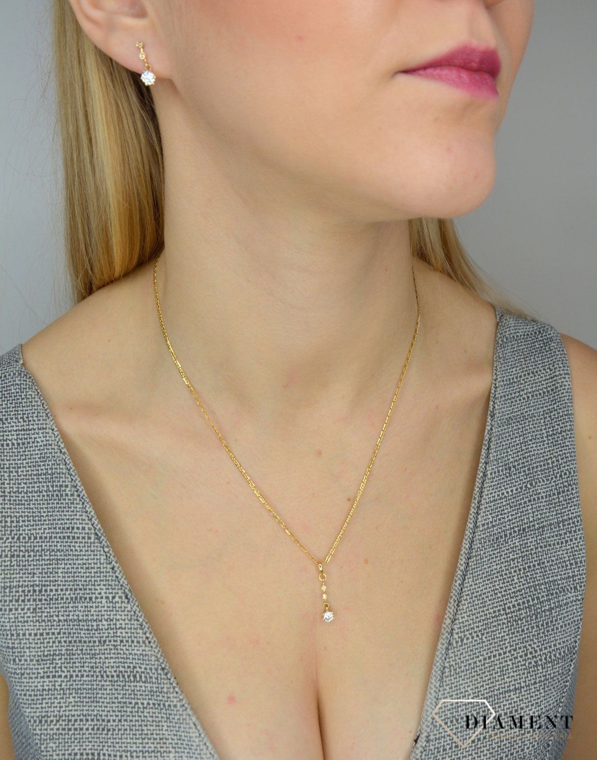 Złote kolczyki 585 wiszące zakończone kwiatkiem DIA-KLC-0987K-585.jpg