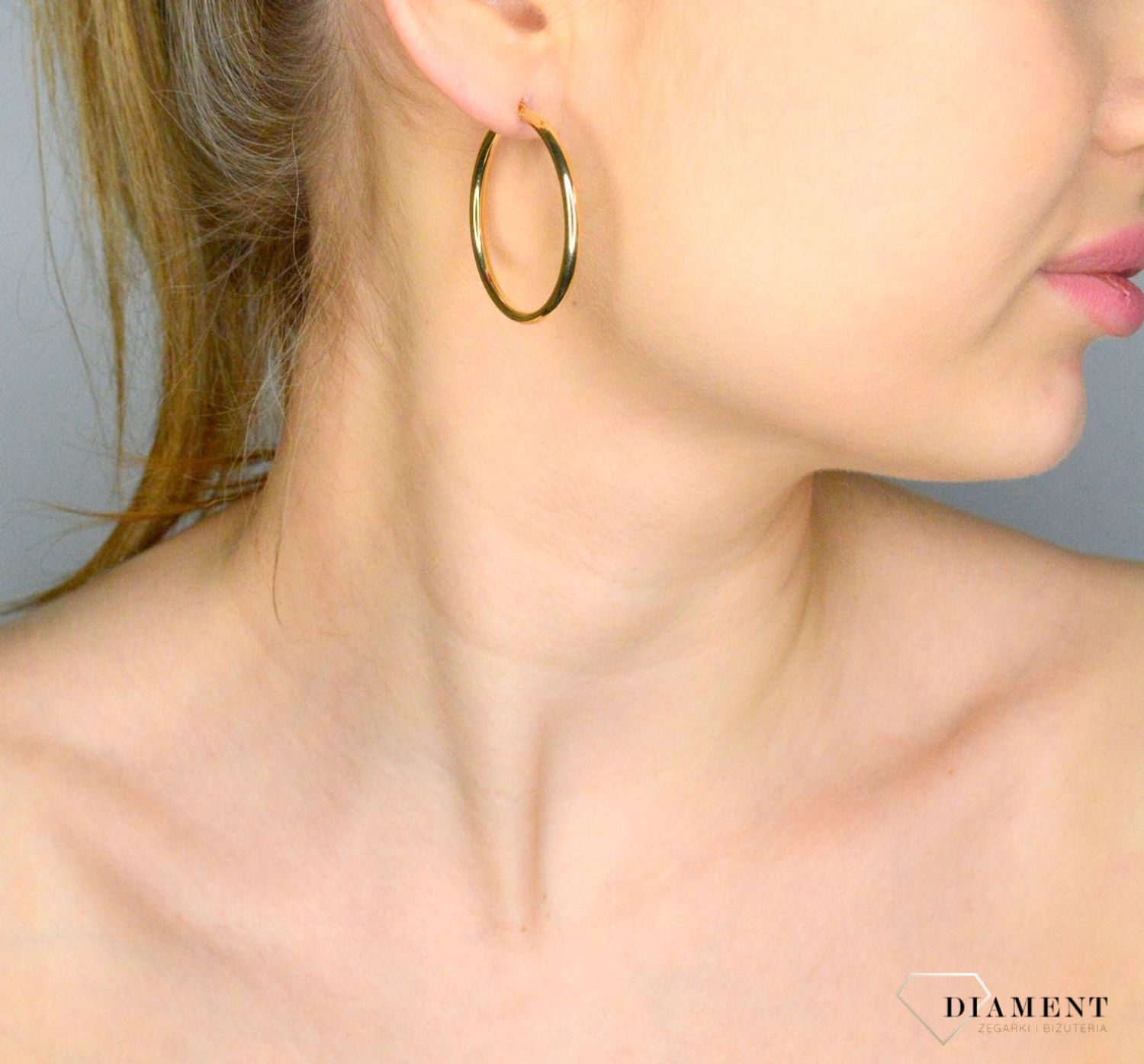 Złote kolczyki damskie 375 złote kolczyki koła DIA-KLC-11181-375  Damska złota biżuteria, to idealny pomysł na prezent. Złota kolczyki damskie o formie gładkich kółek. Kolczyki damskie wygodne i ponadczasowe..webp