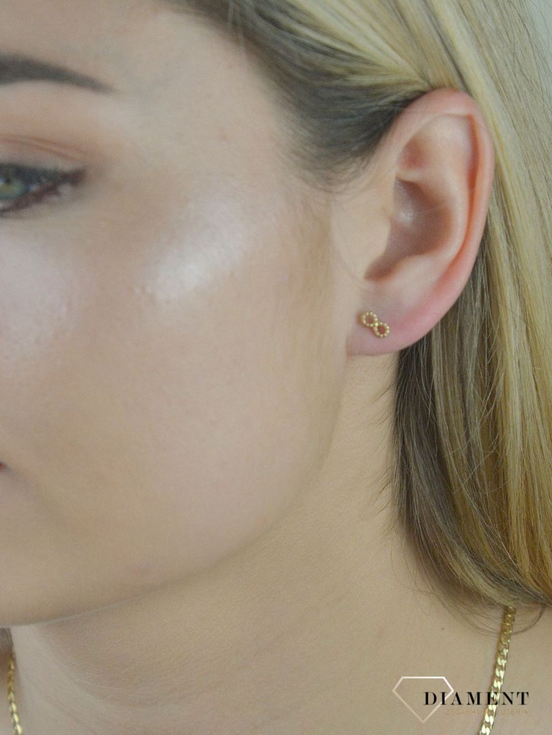 Złote kolczyki 585 znak nieskończoności DIA-KLC-6185-585.  💎 Złote kolczyki z motywem znaku nieskończoności 💎 Świetny dodatek do młodych dziewczyn 💎 Kolczyki wykonane z najwyższej jakości złota próby 58.jpg