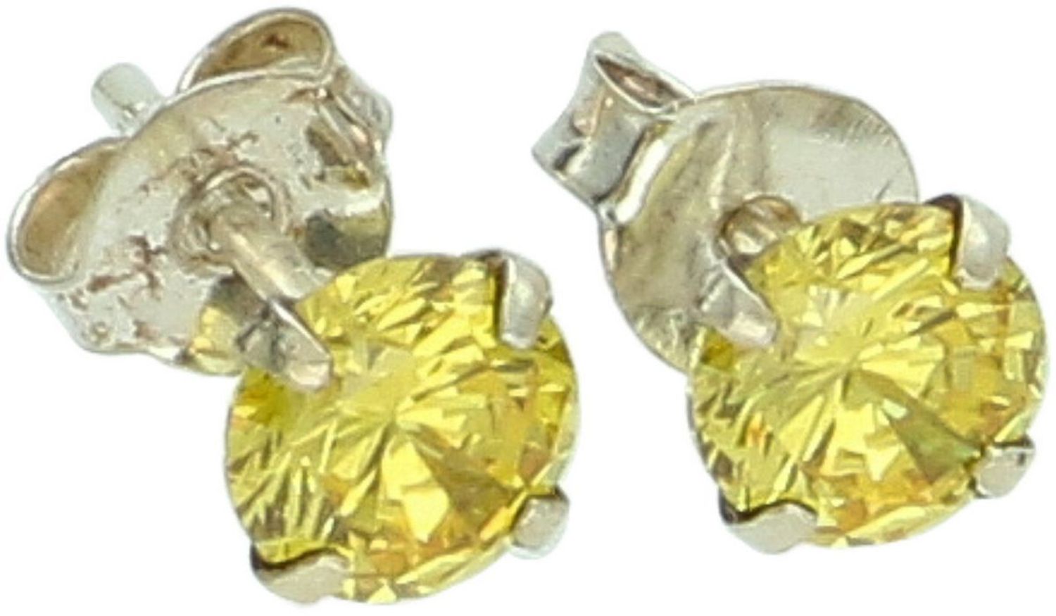 Eleganckie srebrne kolczyki z żółtą cyrkonią, wykonane ze srebra próby 925. Subtelny, promienny dodatek do codziennych stylizacji i modnych setów biżuterii.1.jpg