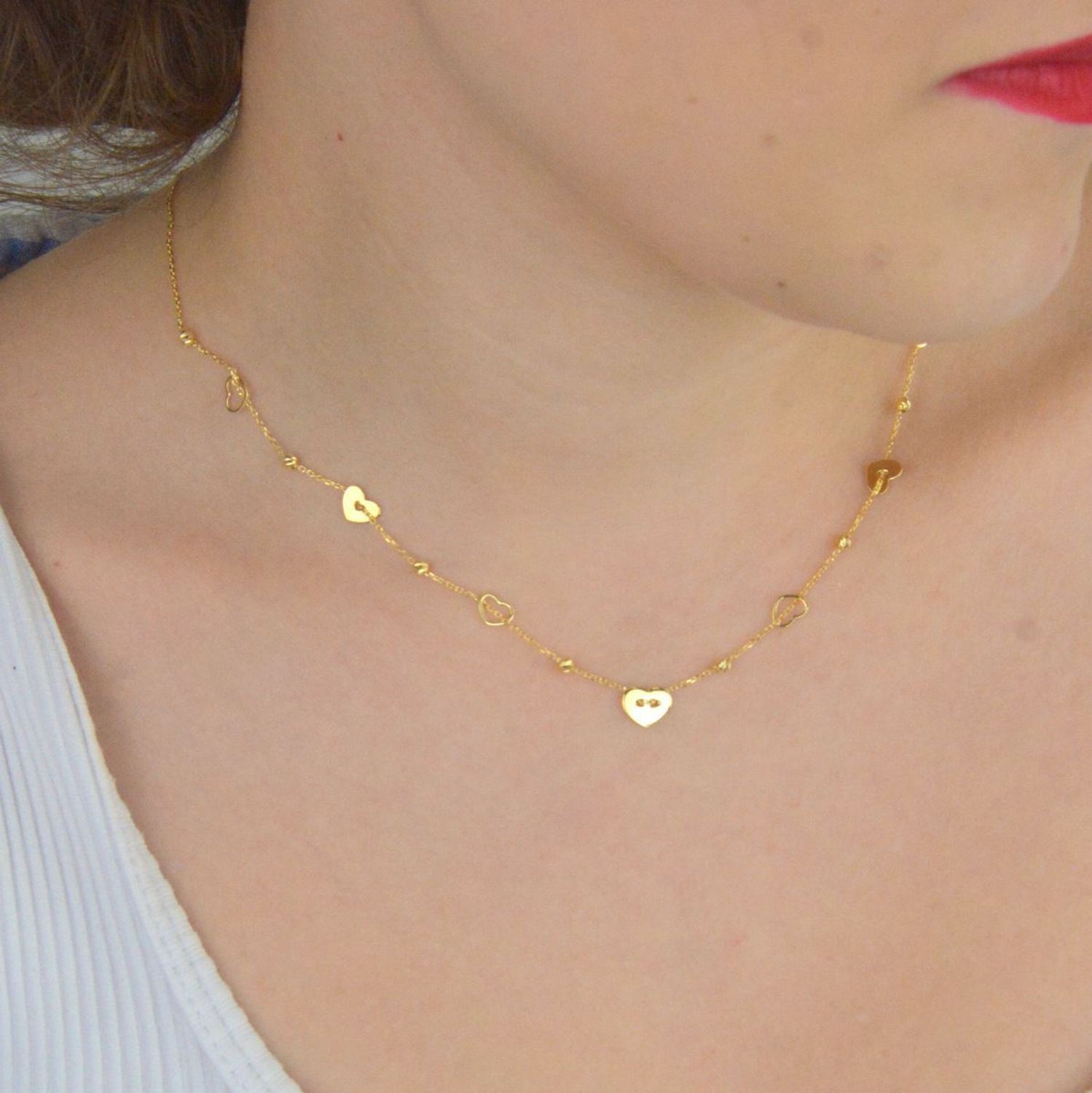 Subtelny naszyjnik damski celebrytka ze złota próby 585, model DIA-NSZ-13789-585. Zdobiony kuleczkami i serduszkami, długość 42 + 3 cm, waga 2,00 g, zapięcie na karabińczyk.1.jpg