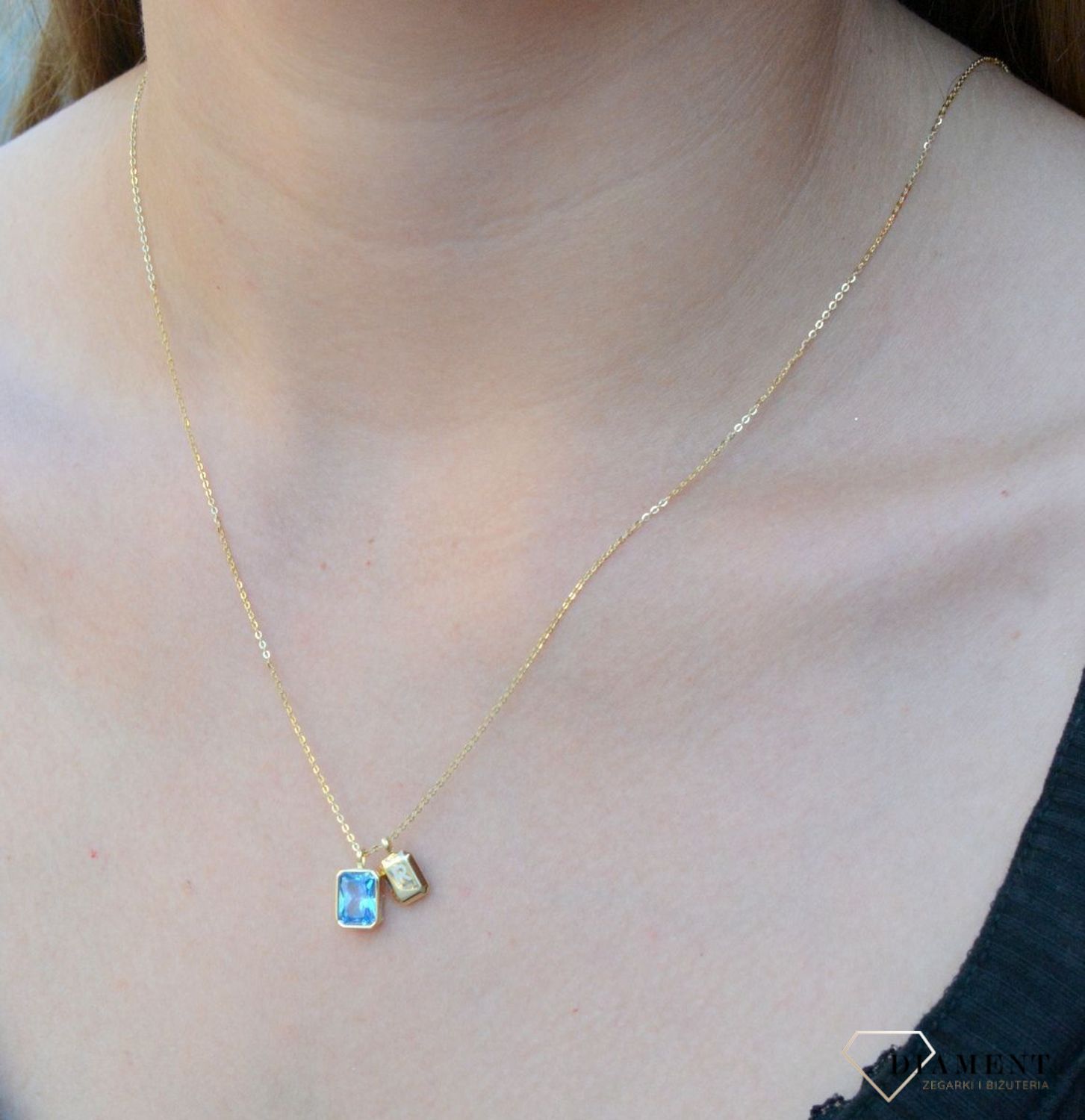 Naszyjnik pozłacany z błękitną cyrkonią DIA-NSZ-6570ZN-925. Jest idealnym pomysłem na prezent. Błękitna cyrkonia dzięki wyjątkowemu szlifowi pięknie mieni się w słońcu, co jest wyrazem najwyższego kunsztu jubilerskiego.jpg