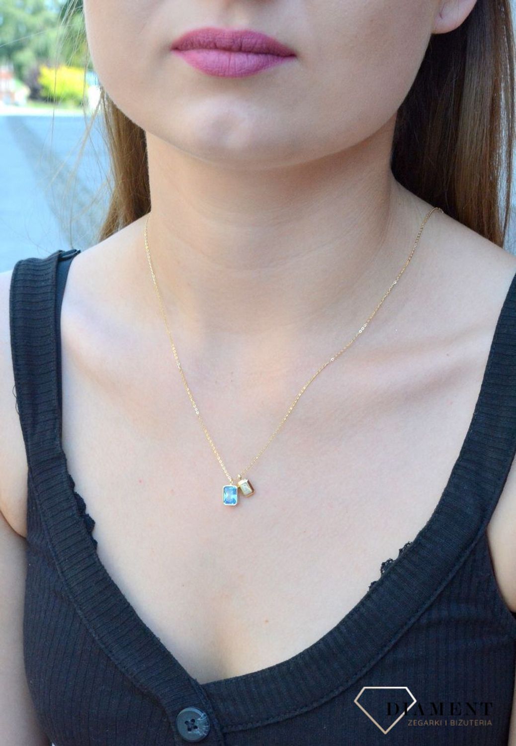 Naszyjnik pozłacany z błękitną cyrkonią DIA-NSZ-6570ZN-925. Jest idealnym pomysłem na prezent. Błękitna cyrkonia dzięki wyjątkowemu szlifowi pięknie mieni się w słońcu, co jest wyrazem najwyższego kunsztu jubilerskiego.jpg