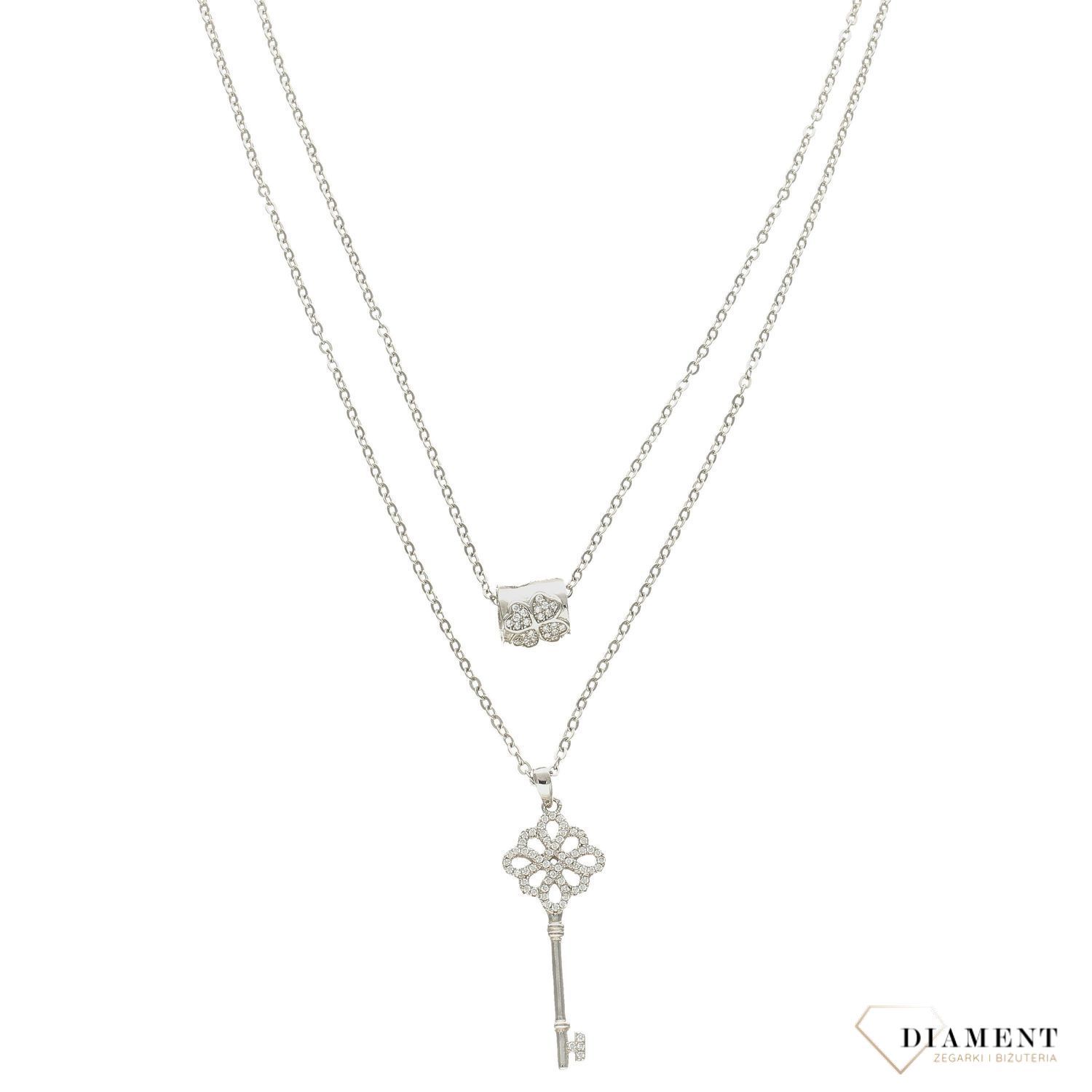 Modny naszyjnik wykonany z najwyższej jakości srebra. Długi łańcuszek z elementami ozdobnymi w postaci kluczyka i owalu. Zapraszamy!.jpg