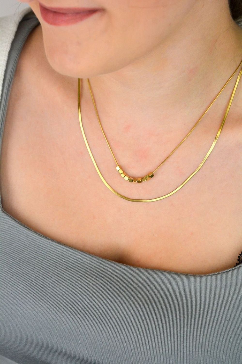 Naszyjnik damski stalowy podwójny z kosteczkami pozłacanymi  DIA-NSZ-W5522436-STAL stal.jpg