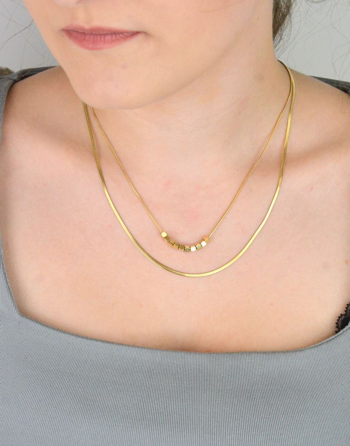 Naszyjnik damski stalowy podwójny z kosteczkami pozłacanymi  DIA-NSZ-W5522436-STAL stal.jpg