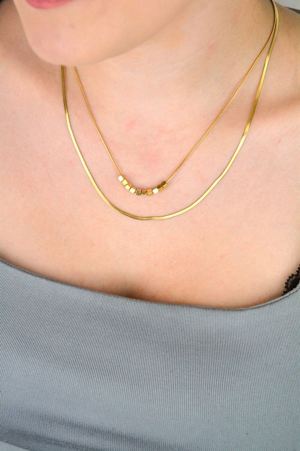 Naszyjnik damski stalowy podwójny z kosteczkami pozłacanymi  DIA-NSZ-W5522436-STAL stal.jpg