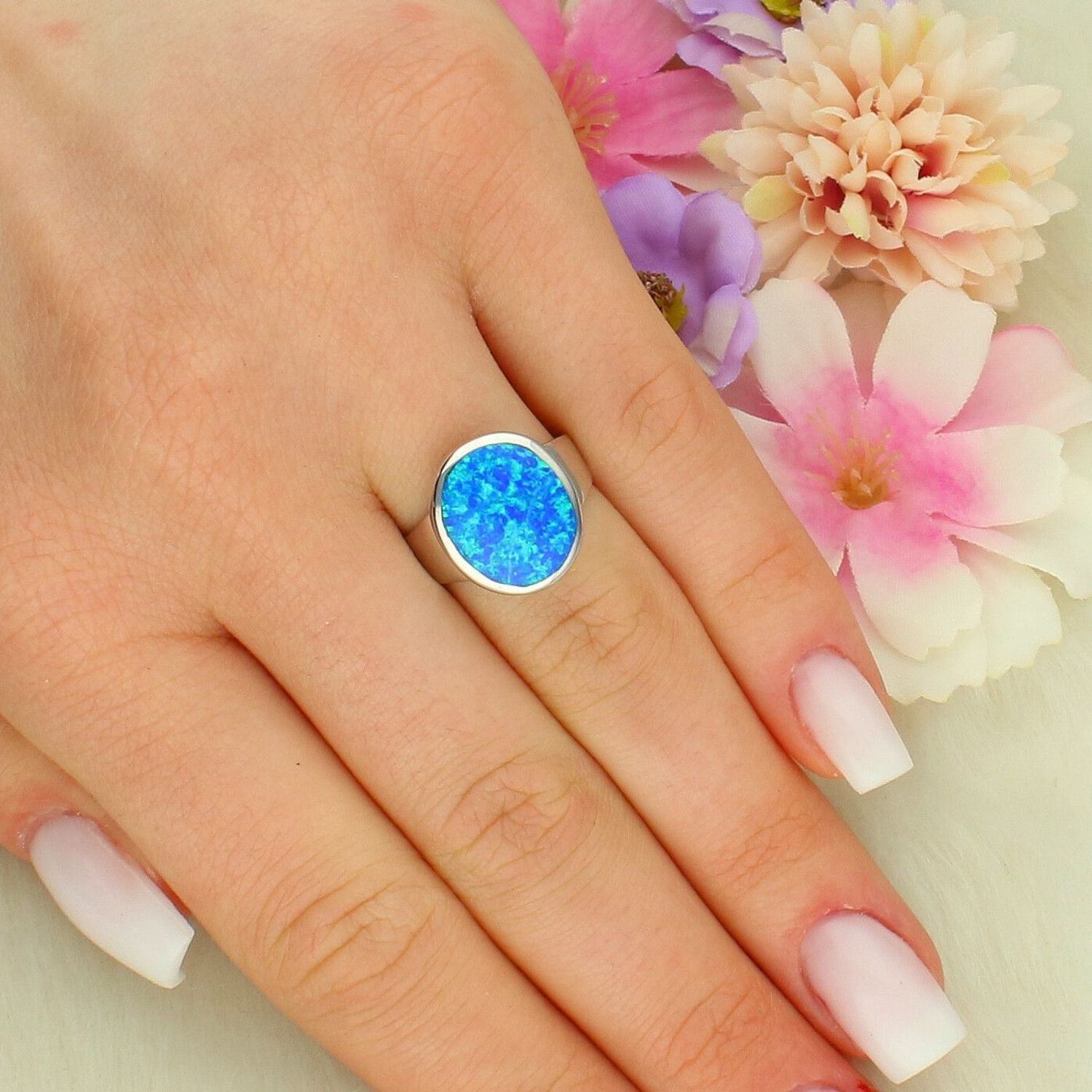 Srebrny pierścionekasa damski 925 z niebieskim opalem – elegancki blask natury DIA-PRS-14115-925 (3).jpg
