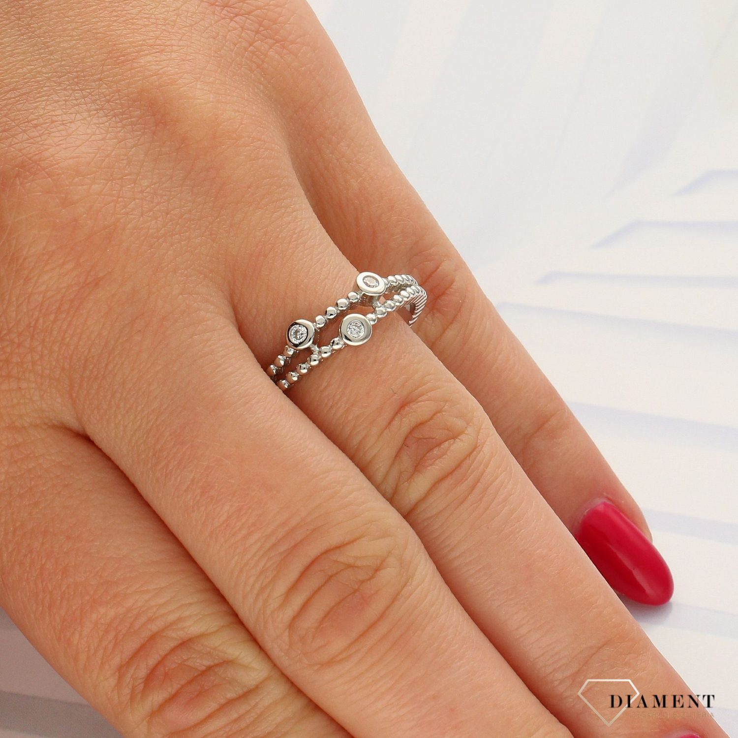 Srebrny pierścionek dwie obrączki z ozdobną cyrkonią DIA-PRS-3710-925 (1).jpg