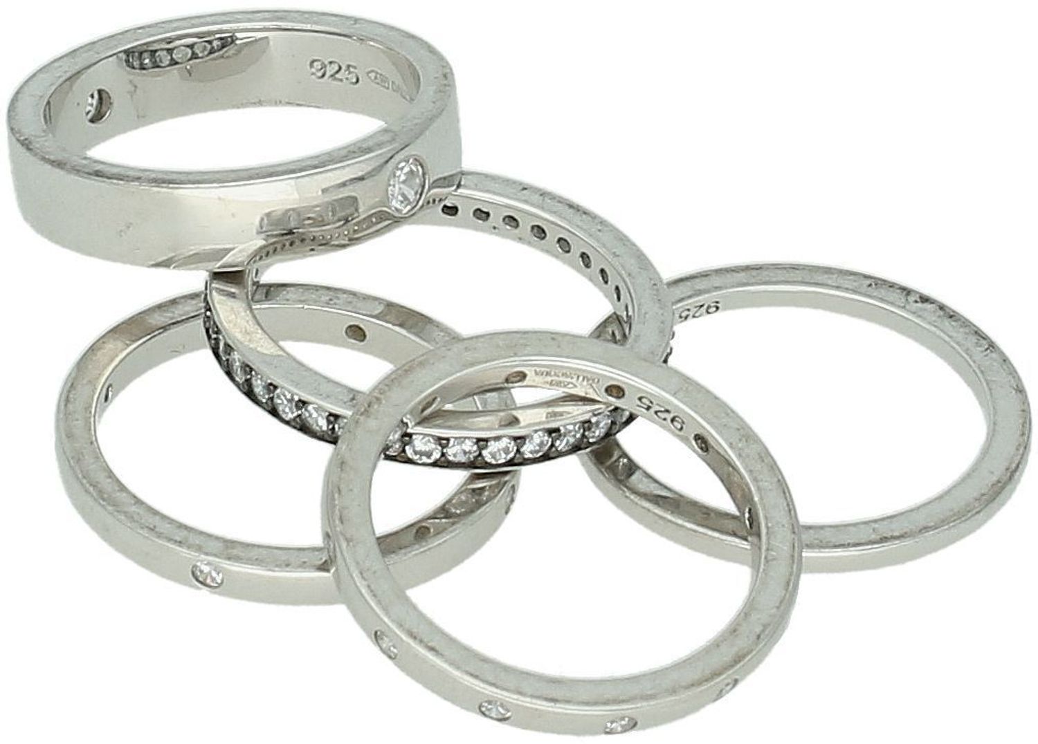 Pierścionek srebrny 925 z pięcioma obrączkami ozdobionymi cyrkoniami. Waga 11,90 g, rozmiar 11. Efektowna biżuteria dla kobiet ceniących styl i blask.1.jpg