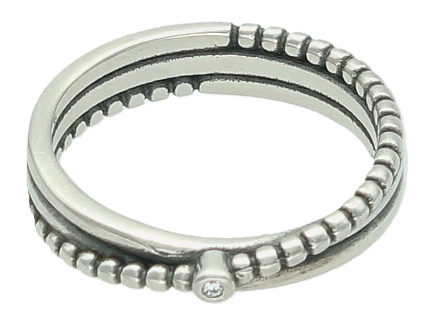 Elegancki pierścionek damski srebrny DIA-PRS-7690-925 z jedną cyrkonią i ozdobnymi srebrnymi kuleczkami. Waga 3,20 g, szerokość 4 mm (górna część), idealny na prezent i codzienne stylizacje.1.jpg