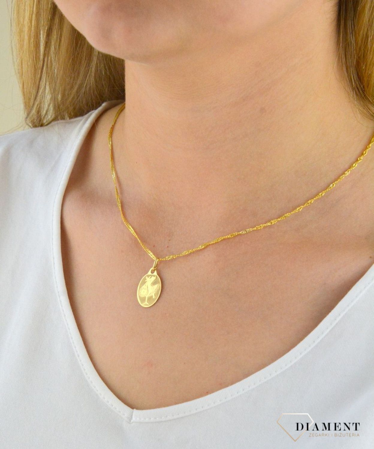 Zawieszka złota owalna Bocian DIA-ZAW-0521-585. Złota owalna zawieszka. Zawieszka symbolizująca narodziny, ciąże. Zawieszka złota dla ukochanej. Złota owalna zawieszka idealna na prezent..jpg