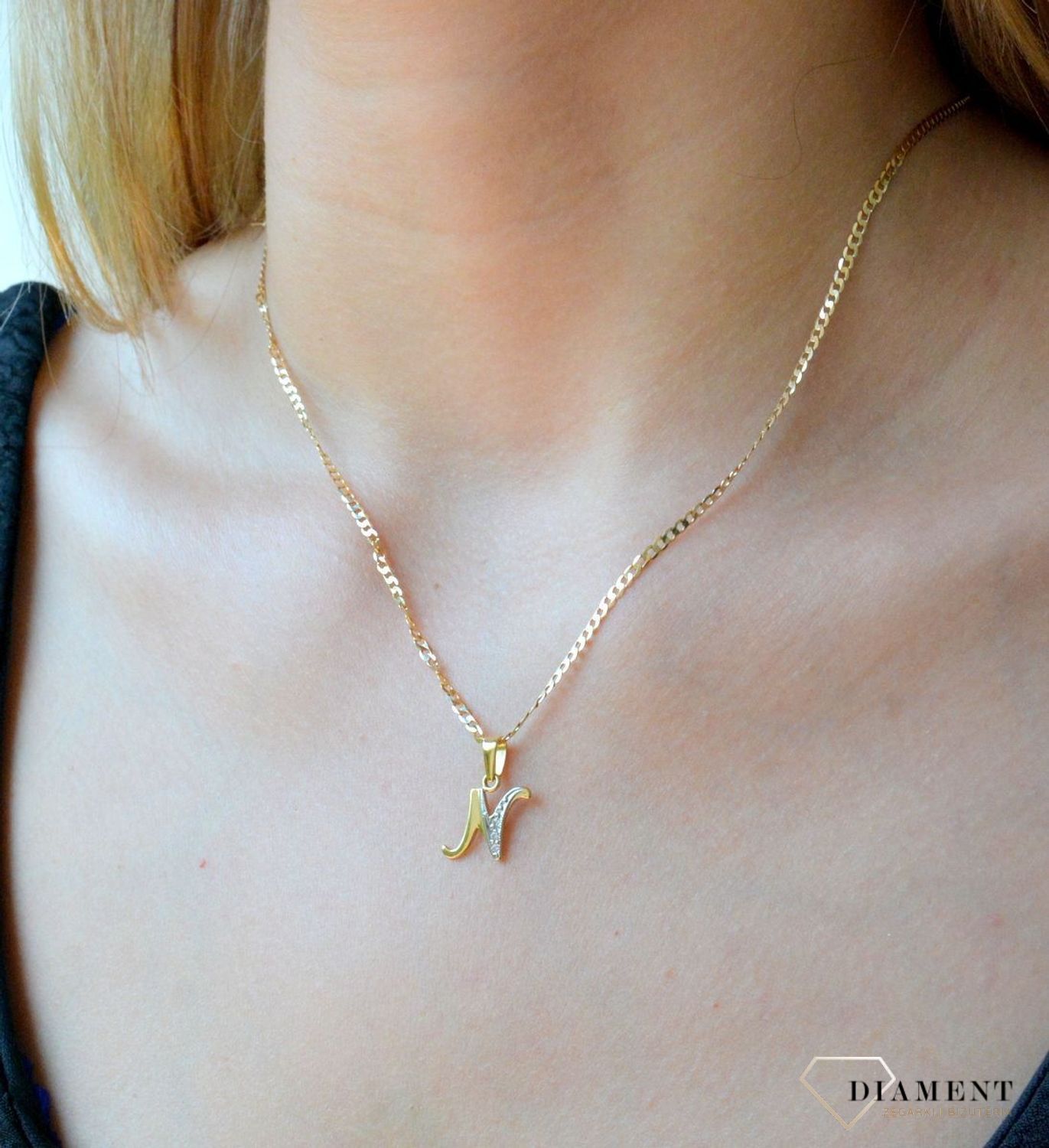 Złota zawieszka 585 literka N ozdobiona cyrkonią DIA-ZAW-10048-585. Złoty wisiorek próby 585. Wisiorek literka z cyrkoniami. Zawieszka złota do łańcuszka literka N. Literka zawieszka idealny pomysł na prezent..jpg