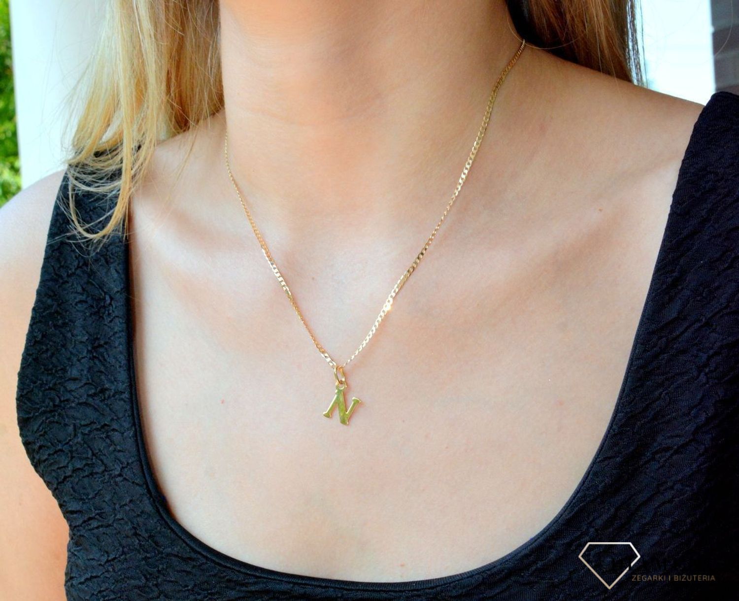 Złota zawieszka 585 literka N DIA-ZAW-10063-585. Wisiorek został wykonany z wysokiej jakości złota próby 585. Wisiorek z literką N. Literka N zawieszka idealna na prezent. Złota zawieszka damska literka..jpg