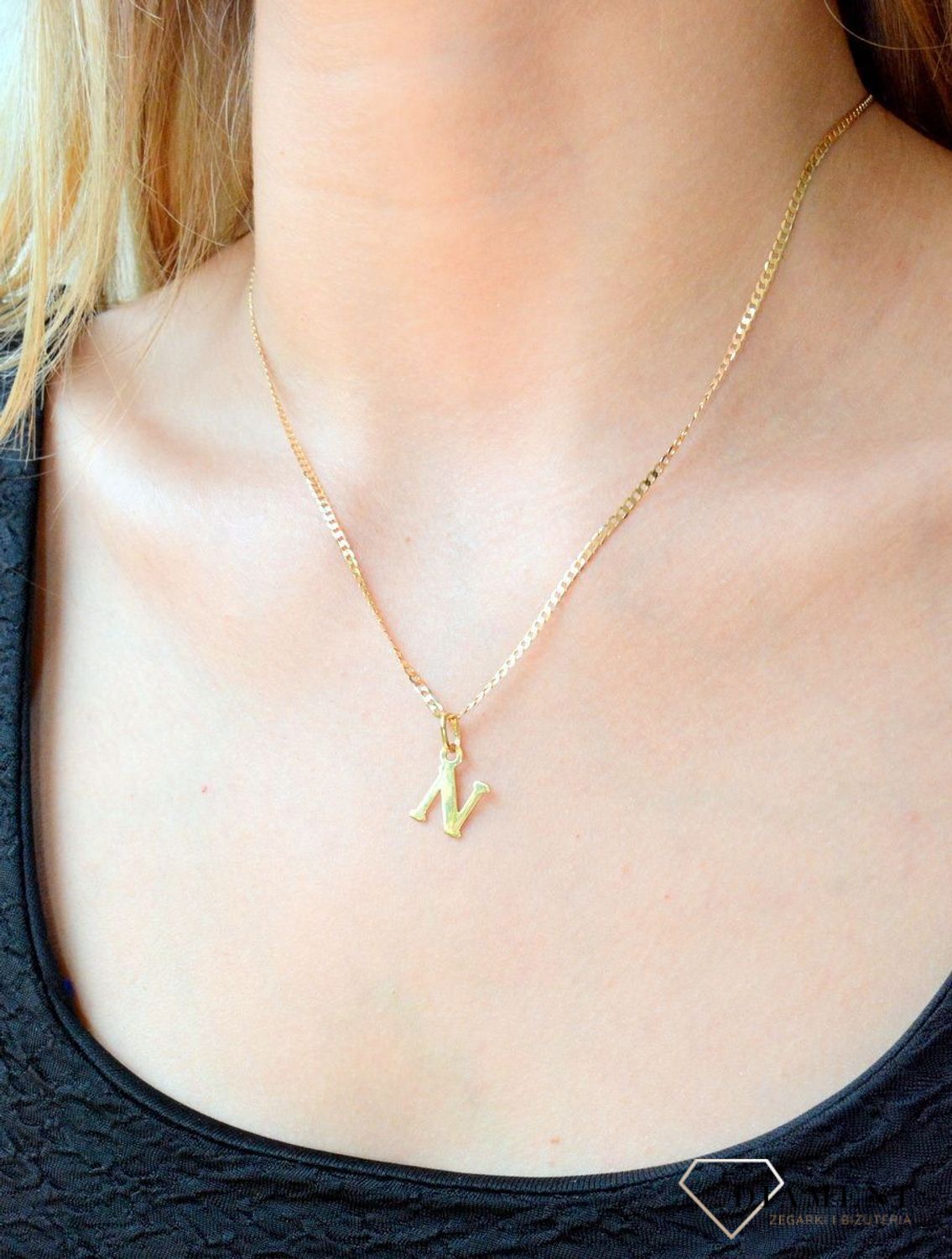 Złota zawieszka 585 literka N DIA-ZAW-10063-585. Wisiorek został wykonany z wysokiej jakości złota próby 585. Wisiorek z literką N. Literka N zawieszka idealna na prezent. Złota zawieszka damska literka..jpg