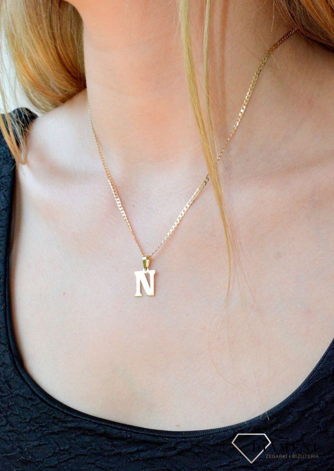 Złota zawieszka 585 literka N DIA-ZAW-10066-585. Wisiorek został wykonany z wysokiej jakości złota próby 585. Wisiorek z literką N. Literka N zawieszka idealna na prezent. Złota zawieszka damska literka..jpg